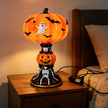 Halloween themed table lamps featuring skull, crying ghost, and skeleton designs on a desk.
