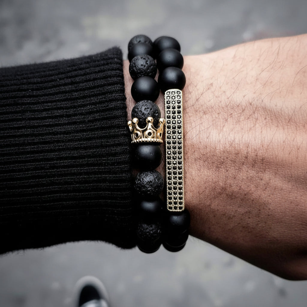 Men's black frosted stone and volcanic stone beaded bracelet with crown and rhinestone details
